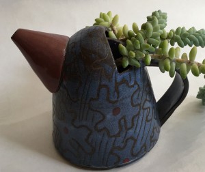 unique teapot with succulents