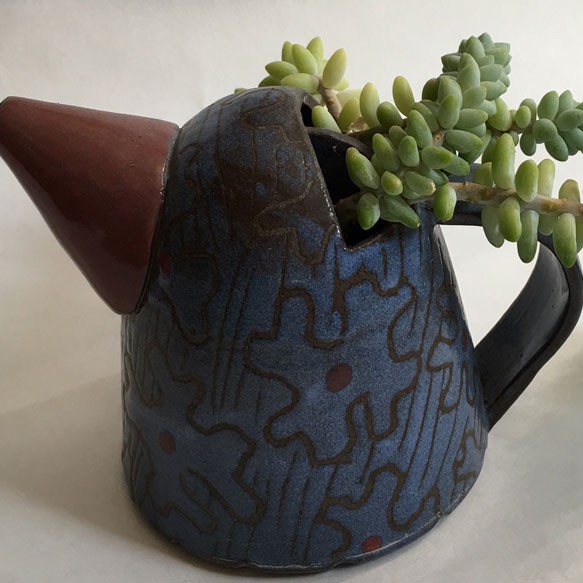 unique teapot with succulents