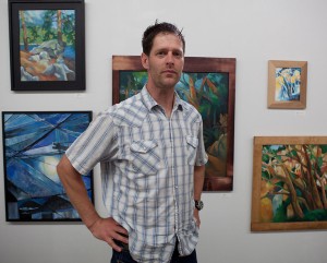 artist with paintings