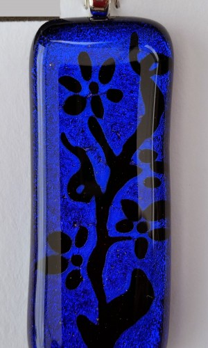 long rectangulae pendane in cobalt blue with a floral motif added in black