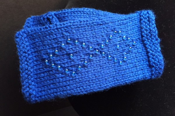 unique crochetted glove with matching beads