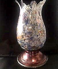 multi-colored glass vase with gold stem