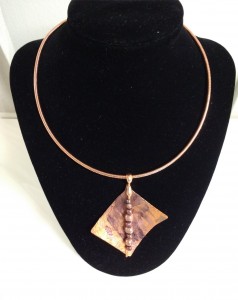 print on copper with string of pearls