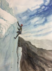 Climber on snow covered cliff