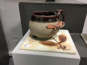 butterfly like image on a ceramic mug with a tile