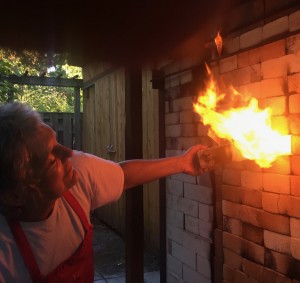 artist working with firing kiln