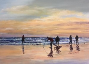 people on the beach at sunset