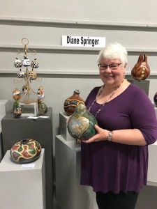 Diane holding a Celtic painted gourd