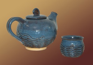 blue colored tea pot with texture