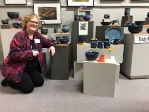 Trudy Woods next to her pottery