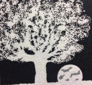 Black and white bead painting of night moon and tree