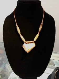 Hand Hammered and shaped copper with copper necklace with tubular clay beads. $89