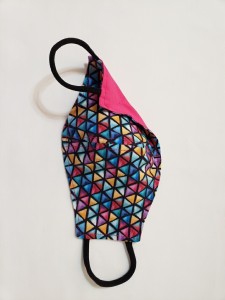 multi-colored diamond pattern with solid pink on reverse side