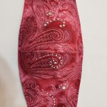 red patterned mask with jewels