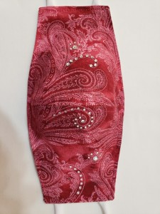 red patterned mask with jewels