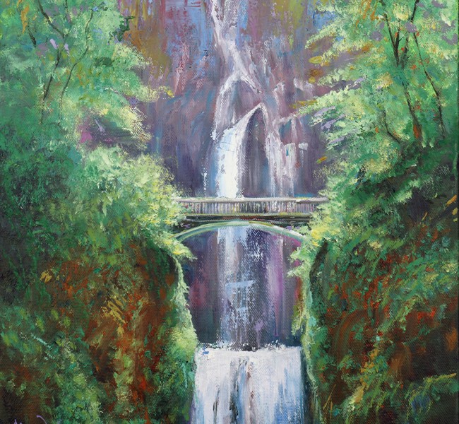 large waterfall with a bridge