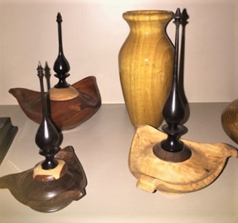 sculptures and vases in various wood
