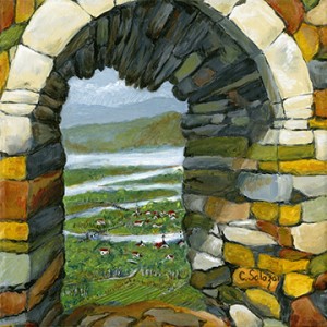 portal view of valley through a stone rock opening