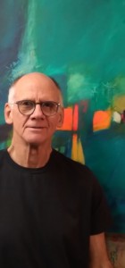 Artist in front of his painting