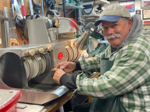 artist fine tuning rocks