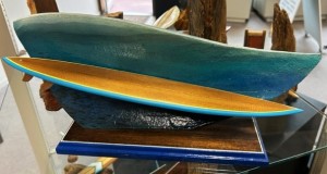 surfboard mounted on a wave shape