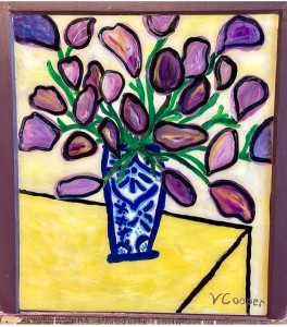 blue vase with flowers on table