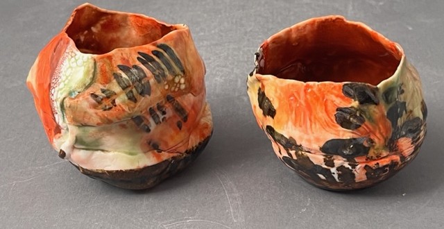 orange colored hand built cups