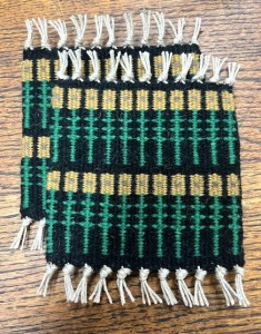 weaving if sunflowers rows in green, black and yellow
