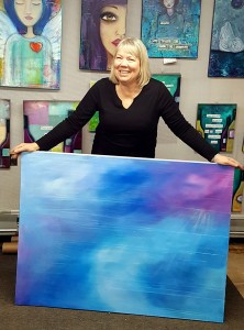 artist holding painting