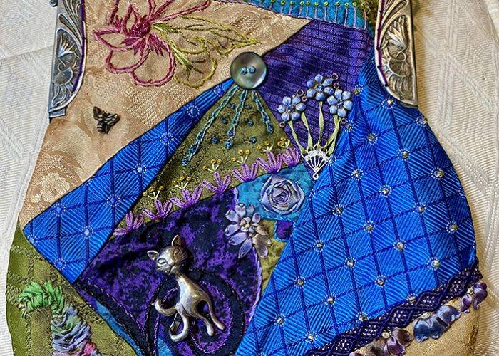 clutch purse with embroidery and stitching