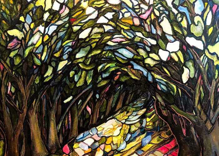 stain glass look of trees arching over a path
